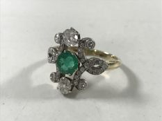 An 18ct gold emerald and diamond Art Nouveau style ring, size M/N.