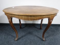 An Edwardian mahogany oval occasional table
