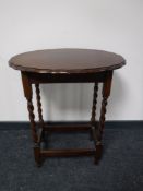 An Edwardian oak occasional table