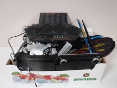 A box containing Yamaha DD6 electric drum board, Nintendo WII games,