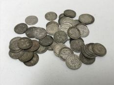 A collection of fifty three penny coins