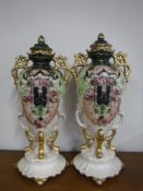 A pair of French gilded classical style urns