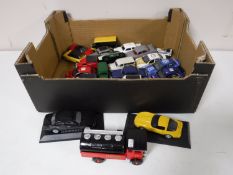 A box containing a quantity of die cast vehicles, Corgi limited edition Jaguar,