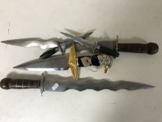 A replica dagger with eagle mounted hilt together with four other ornamental daggers