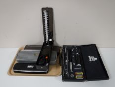 A tray of medical instruments in cases, inspection kit,