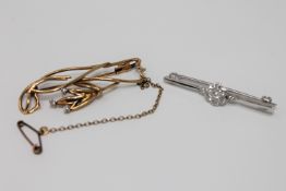 Two gold diamond set brooches, 7.