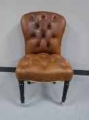 A brown leather studded dining chair