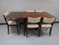 A mid 20th century dining table and five chairs