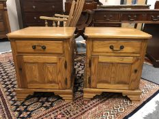 A pair of contemporary oak bedside chests