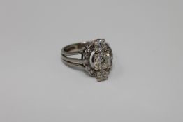 A platinum and diamond ring,