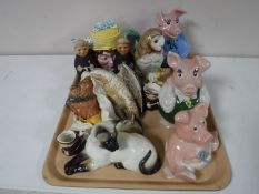 A tray of china ornaments, Royal Doulton barn owl decanter, Wade NatWest ornaments,