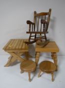 A miniature pine rocking chair, together with further miniature furniture, stool tables, boot jack,