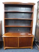An early twentieth century mahogany bookcase on cupboard base