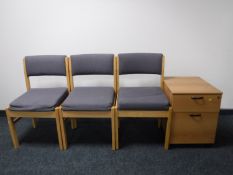 A two drawer beech chest and three chairs
