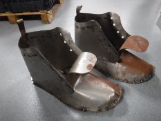 A pair metal garden boot planters