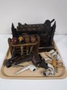 A tray of Edwardian oak pipe rests, antique clay pipes,