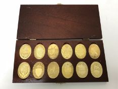 A boxed set of ten commemorative silver-gilt coins,