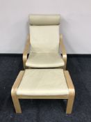An Ikea beech framed armchair with footstool