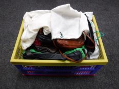 A crate of a collection of leather and other evening and handbags etc