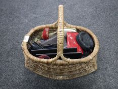 A wicker basket of leather wallets,