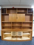A mid 20th century teak office cabinet with shutter door base