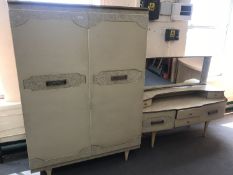 A mid 20th century cream melamine wardrobe and dressing table