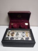 A display box containing ten gent's wristwatches together with an automatic watch winder by Rapport