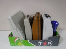 A box containing vintage typewriters, desk lamp on bracket,