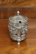 An 18th century French ornate silver mustard pot,