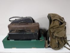 A canvas rucksack containing leather satchel etc, vintage suitcases,