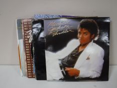 A box of LP's together with a box of CD's and cassettes