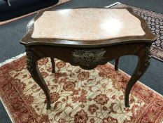 A good quality French ormolu mounted centre table with inset rouge marble top