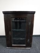 A Victorian oak corner cabinet