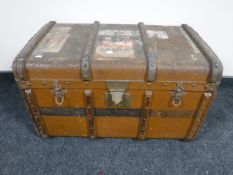 A vintage shipping trunk with shipping labels