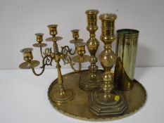 A brass tray together with a brass ammunition shell,