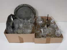 Two boxes containing crystal and glass