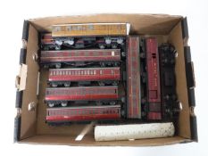 A box containing Hornby Dublo tin plate carriages
