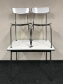 A mid 20th century Formica topped kitchen table and two chairs