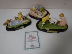 Three Royal Doulton Winnie the Pooh collection ornaments on stands