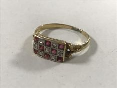 An 18ct gold ruby and diamond ring, size O.