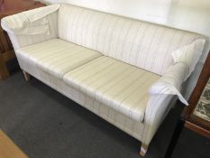 A mid 20th century two seater settee in black striped fabric
