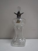 A Victorian glass decanter with silver collar