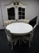 A continental cream and gilt bombe front display cabinet, fitted with four drawers, height 198cm,