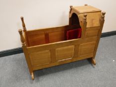 A Yorkshire style panelled oak crib, length 94cm.