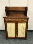 A Regency mahogany secretaire low cabinet, in the manner of Gillows, fitted a cupboard beneath,