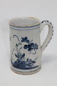 An 18th century blue and white delft mug, height 18 cm.