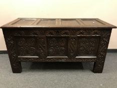 A George III panelled oak coffer, with original key, width 139 cm.