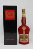 Cherry Marnier - gold ribbon and seal in velvet bottle, 23 1/4 fl oz, boxed.