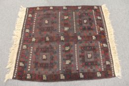 A Balouch Soffreh rug, 135cm by 111cm.