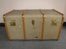 An early 20th century canvas and wooden bound travelling trunk, width 91cm.